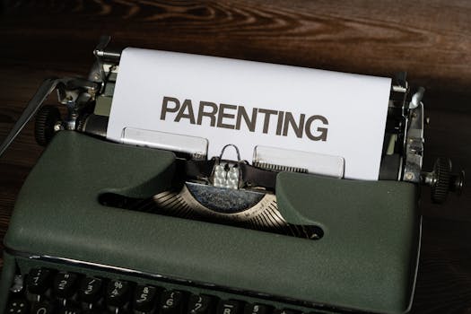 Close-up of a vintage typewriter typing the word 'PARENTING' on paper.